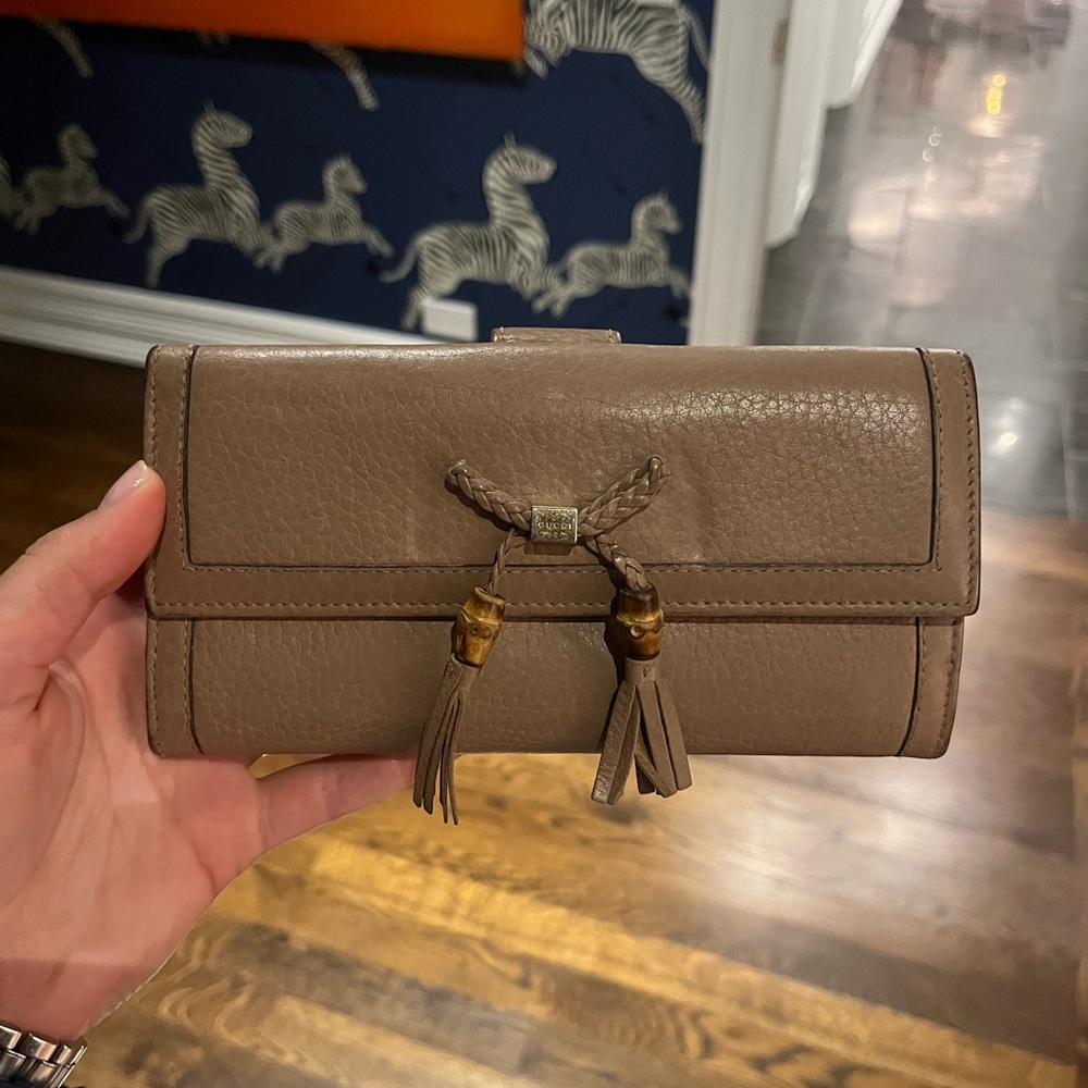 Gucci leather bamboo bow + tassel trifold flap wallet w/ gold hardware
